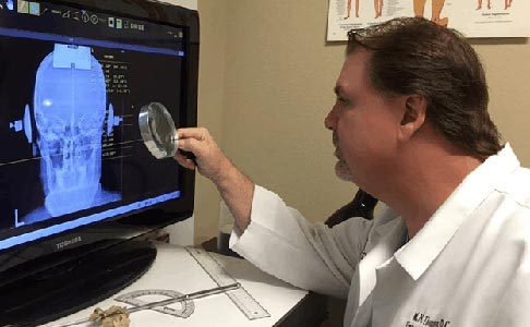 Chiropractor Flower Mound TX Michael Thompson Examining X-ray