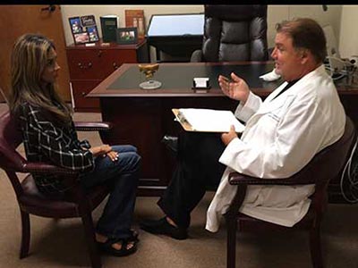 Chiropractor Flower Mound TX Michael Thompson Patient Consultation